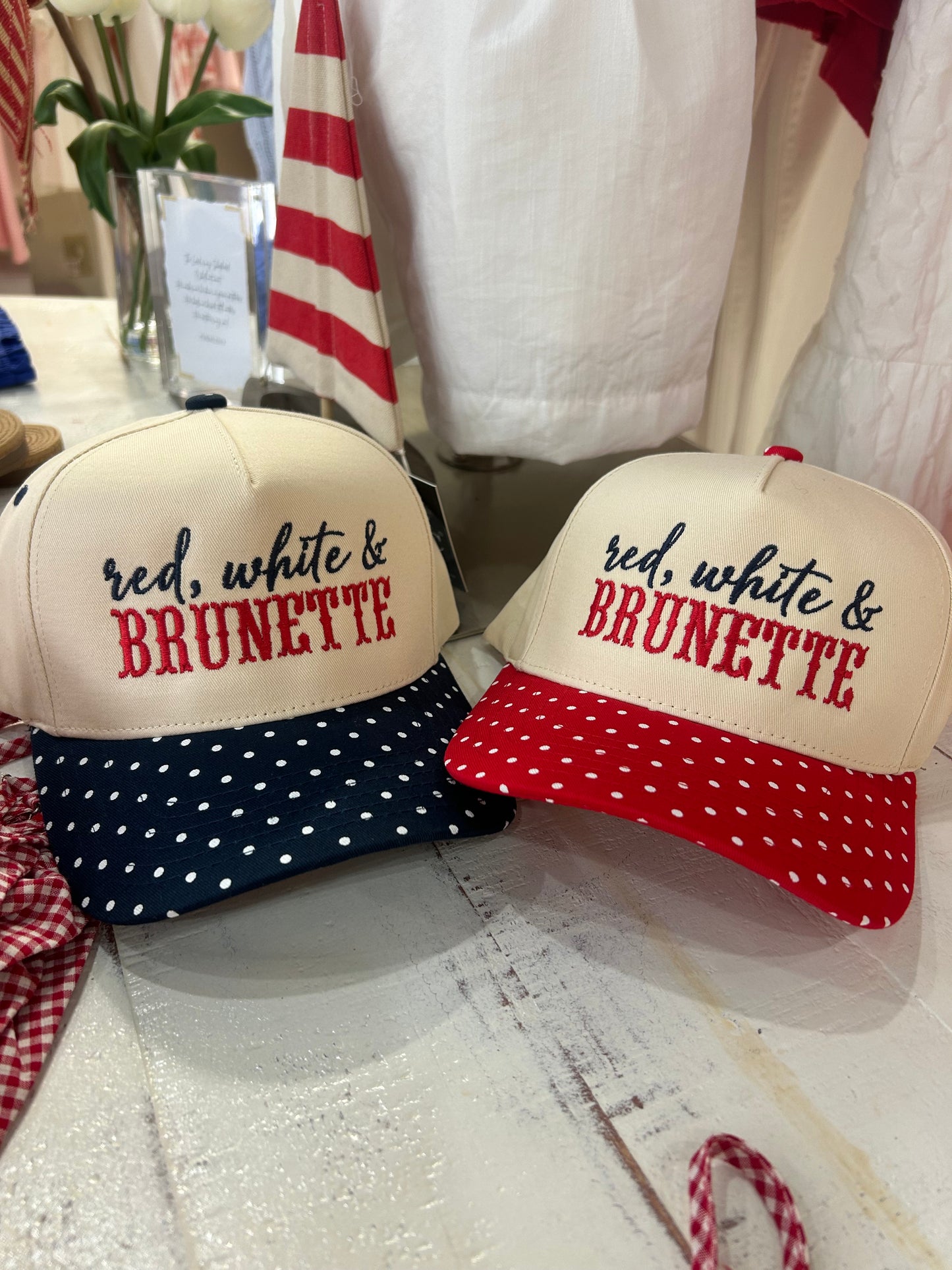 RED, WHITE AND BRUNETTE TRUCKER HAT